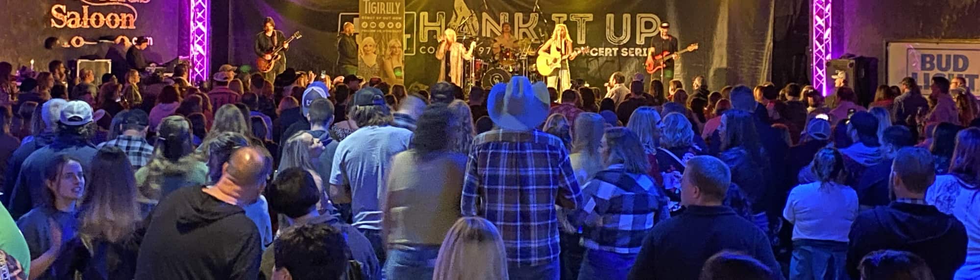 country concert with fans wearing cowboy hats El Paso