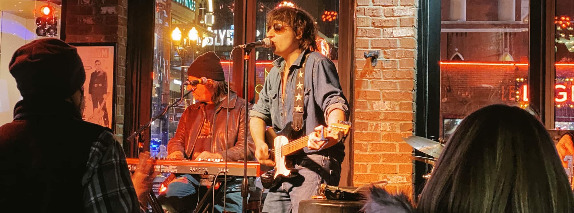 bar singer on guitar in El Paso